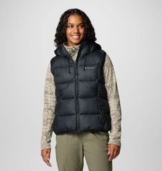 A versatile hooded puffer vest built to take on cold in comfort and style. Hooded Puffer Vest, Hiking Jacket, Youth Shoes, Suit Shoes, Body Warmer, Sportswear Brand, Mens Sportswear, Columbia Sportswear, Body Heat