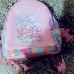 Dolls Kill Candyland Backpack. New. Never Used. Patent Vegan Leather. Candyland, King Kandy & His Castle, Pathway, & Lollipop Graphics. Adjustable Shoulder Straps. Approx. 9" W X 10.25" H X 6" D Harajuku Style Purple Backpack For Daily Use, Harajuku Style Purple Bag For Back To School, Kawaii Purple Backpack For Everyday Use, Harajuku Style Purple Backpack For Everyday, Harajuku Style Purple School Bag, Kawaii Pink Backpack With Cute Design, Pink Kawaii Backpack With Cute Design, Playful Pink Backpack, Playful Pink Standard Backpack