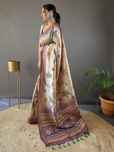 Introducing the epitome of understated elegance and timeless charm - the beige and brown silk saree adorned with exquisite Kalamkari print work and delicately attached tassels on the pallu. With 5.50 meters of sheer sophistication, this saree is poised to become the centerpiece of your wardrobe, adding a touch of breezy vibrancy to your upcoming festivals, occasions, and other special functions.
The fusion of beige and brown hues creates a harmonious palette that exudes warmth and sophistication Diwali Beige Traditional Drape Blouse Piece, Diwali Beige Saree Blouse Piece, Unstitched Beige Bollywood Saree, Unstitched Elegant Kalamkari Blouse Piece, Beige Saree For Eid, Brown Banarasi Silk Traditional Wear, Beige Raw Silk Saree With Pallu, Traditional Brown Banarasi Silk Wear, Beige Saree With Pallu In Traditional Drape