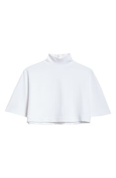 A high neck, a cropped length and flared dolman sleeves bring a striking silhouette to a far from simple T-shirt that can easily layer or solo. 14 1/2" length (size X-Small) Back snap closure Mock neck Elbow-length sleeves 100% cotton Machine wash, dry flat Made in Italy Designer Clothing White Stretch Tops With Funnel Neck, Boxy Fit Cropped Tops, Cropped Boxy Fit Tops, Oversized White Crop Top For Spring, Boxy Cropped Tops, White Cropped Hem Tops For Fall, Oversized Cropped T-shirt, Chic Boxy Cropped Top, White Oversized Funnel Neck Top