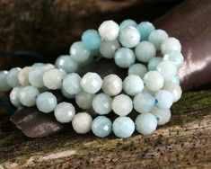 Capture the calming colors of a clear sky with these microfaceted amazonite rounds. Perfectly polished and precision faceted, they have undeniable sparkle and shine. Float them alongside silver charms for a serene, airy vibe in your design. Amazonite beads and focals look expensive, but won't break your bank account! These semi-opaque, blue-green stones vary from pale seafoam to darker aqua. Amazonite, also known as Amazon stone, is a classic case of mistaken identity. A greenish color stone was Amazonite Faceted Round Beads Jewelry, Aquamarine Faceted Beads Jewelry, Faceted Amazonite Round Beads Jewelry, Turquoise Faceted Amazonite Jewelry, Faceted Turquoise Amazonite Jewelry, Faceted Aquamarine Round Beads Jewelry, Faceted Aquamarine Beads Jewelry, Look Expensive, Green Stones