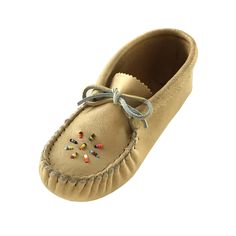 a pair of tan shoes with colorful beads on the side and a bow at the top