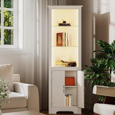 a living room with white furniture and a potted plant