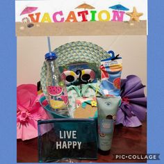 an assortment of items is displayed in front of a sign that reads vacation live happy