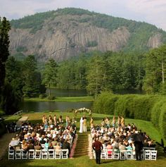 an outdoor wedding ceremony in the mountains