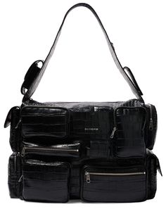 Find BALENCIAGA Superbusy Leather Sling Bag on Editorialist. Height: 29cm Width: 42cm Depth: 19cm. Fixed strap. Top zip closure. Front logo details. All over embossed pattern placement may vary. Multiple front and side 3D pockets. One back zip pocket Sling Bag Black, Balenciaga Men, Embossed Pattern, Leather Sling Bag, Balenciaga Bag, Crossbody Messenger Bag, Strap Top, Work Bags, Swim Accessories