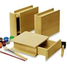 wooden boxes with paint, brushes and paints