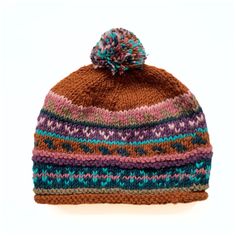 This 100% wool stocking hat keeps you warm and looking good . It is fully lined with soft fleece. It's sure to be a great look on both men and women. Handmade in Nepal Materials: 100% wool (outer), polar fleece (interior) One size fits most Cold water hand wash (or dry clean); lay flat to dry With every product you purchase, you are helping provide employment, educational opportunities and medical care to artisans in Nepal. Wool Hats With Fleece Lining For Cold Weather, Wool Crochet Hat For Winter, Cozy Hats With Fleece Lining For Cold Weather, Cozy Hat With Fleece Lining For Cold Weather, Cozy Fleece-lined Hats For Cold Weather, Brown Fleece-lined Cap, Brown Cap With Fleece Lining, Winter Alpaca Soft Knit Hat, Winter Soft Knit Alpaca Hat