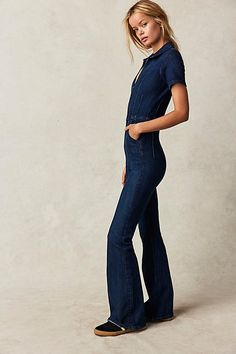 Our top-rated Jayde Flares — now in a stunning jumpsuit! The timeless flare silhouette you know & love in a curve-hugging instant outfit. **Fit:** Slim through the bodice and thigh with flared leg design **Features:** Exaggerated yoking and darting throughout, zip-up closure, collared neckline, vintage-inspired denim wash, stretch denim **Why We | We The Free Jayde Flare Jumpsuit at Free People in Dark Wash, Size: L Spring Flare Fitted Jumpsuits And Rompers, Fitted Short Sleeve Jumpsuits For Fall, Fitted Full-length Denim Jumpsuit, Chic Fitted Flare Jumpsuits And Rompers, Chic Fitted Denim Jumpsuit With Short Sleeves, Elegant Fitted Denim Jumpsuit For Spring, Free People Jumpsuit, Sky Fit, Flare Jumpsuit