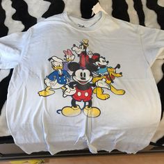 a white shirt with mickey mouse on it