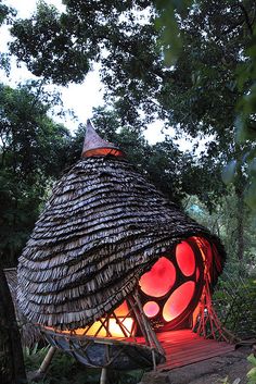 a small hut made out of sticks and lights