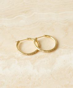 June Baguette Hoops Gold Nothing completes an outfit like an heirloom-quality piece of jewelry. Inspired by vintage pieces in Jenni’s own collection, this edited assortment of fine jewelry aims to add an air of understated investment to your everyday. Made with an understated sensibility and intentional aesthetic, each piece is designed to serve as a thoughtful addition to your daily uniform—one that you will treasure for seasons to come. 14k solid gold hoops with baguette diamonds. Made in Los Intentional Aesthetic, Daily Uniform, Jeweled Shoes, Hoops Gold, Jenni Kayne, Baguette Diamonds, Recycled Gold, Baguette Diamond, Gold Hoops