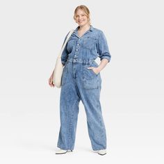 Embrace laid-back style with this Long-Sleeve Utility Baggy Denim Jumpsuit from Universal Thread™. Made of cotton and lyocell, this long-sleeve jumpsuit features a collared neckline with button-down style. This straight-leg jumpsuit comes with a fly button and zipper for a snug, stay-put fit. Designed with barrel cuffs, this jumpsuit sports two front pockets, two side pockets and two back pockets. Universal Thread™: Found exclusively at Target. Baggy Denim, Boiler Suit, Shipt Shopper, Long Sleeve Jumpsuit, Hem Style, Laid Back Style, Denim Jumpsuit, Universal Thread, Linen Women