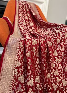 This beautiful Maroon Color Pure Khaddi Georgette Banarasi Saree is a must have for any special occasion! Crafted with love, this saree features a luxurious fabric that is sure to make you stand out.   🌸fabric- pure Khaddi Georgette  🌸color-maroon 🌸pico and fall- yes , saree is ready with fall  and pico. 🌸blouse, yes blouse piece comes with saree 🌸wash method- dry cleaning only  🌸work- saree hai all over golden zari jaal work. 🌸Saree comes with unstitched blouse piece  Ready to wear saree Wedding Jamawar Dupatta With Zari Work, Red Banarasi Silk Lehenga With Sheer Dupatta, Wedding Katan Silk Salwar Kameez With Dori Work, Katan Silk Lehenga With Dori Work For Wedding, Wedding Lehenga In Katan Silk With Dori Work, Red Georgette Dupatta For Celebration, Red Elegant Anarkali Set For Traditional Ceremonies, Elegant Red Anarkali Set For Traditional Ceremonies, Traditional Drape Banarasi Silk Sharara For Wedding