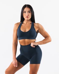 HIGHLIGHTS. Seamless construction Rib panel to contour and support Low to Medium impact Moisture-wicking breathable fabric Flattering scoop neckline A/B/C cup size FIT SUGGESTION. This item runs true to Alphalete's standard seamless fit.. We recommend sizing up for a comfortable fit.. Brooke is 5’5”/165cm, wearing a size S with a 35”/88.9cm bust. Hannah is 5'11/180.3cm, wearing a size L with a 42.5"/108cm bust. MATERIALS AND WASHING DIRECTIONS. 51% Polyamide, 38% Polyester, 11% Elastane. We reco Ribbed Paneling, Pose References, C Cup, A B C, Cup Size, Scoop Neckline, Moisture Wicking, Breathable Fabric, Coco