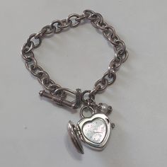 Ecclissi Heart Locket Watch Sterling Silver Chain Bracelet #32760 Toggle Clasp Moisture Resistant Formal Metal Charm Bracelet With Chain, Formal Metal Charm Bracelet, Formal Metal Charm Bracelet With Lobster Clasp, Metal Chain Bracelet With Clasp As Gift, Metal Chain Bracelet As Gift, Metal Bracelets With Clasp For Gifts, Silver Metal Heart Bracelet With Chain, Silver Metal Chain Bracelet For Valentine's Day, Silver Heart Chain Bracelet In Metal