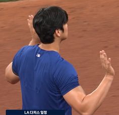 a man holding a tennis racquet on top of a tennis court