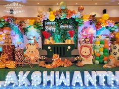 an animal themed birthday party with balloons and decorations