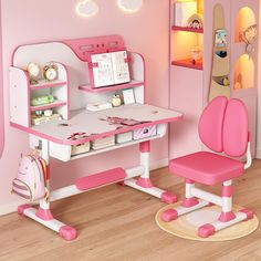 a child's desk and chair in a pink room