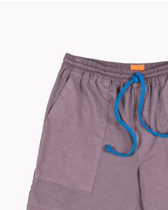 DESCRIPTION Classic summer camp shorts. These fit like our Tana short, with a shorter inseam hitting the mid-thigh. An easy fit, the elasticated waistband is detailed shirting and ties at the front with a contrast drawstring. Your go-to for après beach, chilling, dad-ing. DETAILS 100% deadstock cotton Casual Bermuda Pajama Shorts With Elastic Waistband, Sporty Summer Cargo Shorts, Summer Drawstring Cargo Shorts, Summer Cargo Shorts With Drawstring, Casual Relaxed Fit Cargo Shorts With Drawstring, Casual Cargo Shorts With Drawstring And Relaxed Fit, Sporty Cargo Shorts With Drawstring For Summer, Cotton Cargo Shorts With Drawstring, Sporty Bermuda Cargo Shorts For Summer