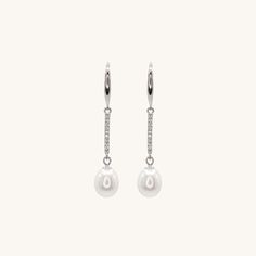 Elevate your style with these stunning sterling silver dangling pearl earrings. These versatile earrings are suitable for any occasion, making them an essential addition to your jewelry collection. For a complete look, pair them with our classic pearl bracelet or necklace collection. Dangling Pearl Earrings, Luxury Box Design, Freshwater Pearl Drop Earrings, Pearl Dangle Earrings, Necklace Collection, Pearl Types, Pearl Earrings Dangle, Pearl Color, Pearl Size