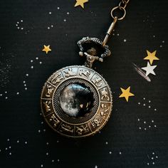 "A beautiful antique bronze or silver tone pocket watch necklace featuring a very special Moon phase - yours! You provide a date for us, we look up what the phase of the Moon was that night, and we create this timeless (haha, pun intended) keepsake that makes a wonderful gift. There is also space inside for you to place a photo should you choose. The pocket watch runs on a regular watch battery that is changeable, pops open with the easy click of a button on the top and is easily set by turning Silver Antique Finish Pocket Watch Gift, Bronze Round Pocket Watch For Gift, Silver Brass Pocket Watch As Gift, Engraved Bronze Pocket Watch As Gift, Antique Finish Pocket Watch As Gift, Vintage Silver Pocket Watch In Brass, Vintage Silver Brass Pocket Watch, Antique Silver Brass Pocket Watch, Silver Brass Pocket Watch With Locket