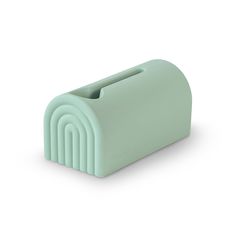 a mint green paper dispenser on a white background