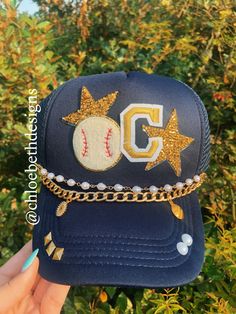 Hat in picture is navy, however, we can do any color hat you would like!! We can also replace baseball patch with softball, soccer, or basketball.  Hat chains are removable with clasps on each end. They can be bought separate or with the hat. Please allow up to 2 weeks for this hat to ship as this is a pre-order item.  $10-$12 chain options do not include hats.  $40-$50 bling hat options do include trucker hat and bling as pictured.  For clarification when purchasing: If you purchase one of the Cheap Sports Hats With Logo Patch, Trucker Patch Hats, Diy Trucker Hat With Patches, Diy Baseball Hat, Trucker Hats With Patches, Baseball Fits, Chains Cross, Baseball Mom Hat, Sporty Mom