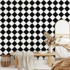 a bedroom with black and white checkered wallpaper