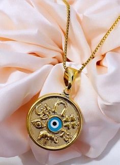 Evil Eye Necklace, Evil Eye Protection Necklace, Evil Eye Pendant Necklace, Protection Handmade Jewelry, 18K Gold Filled Necklace. ❄️Our Small Round Evil Eye pendant features a glass-style stone with a high polish finish. This lovely necklace is perfectly suited for you. The simple 18k gold evil eye jewelry makes an elegant addition to the fine jewelry collection of any woman. ❄️Our Gold Filled is made with 3%(1/30) gold content using 18Kt. The base metal for this type of jewelry is brass. Gold Gold Evil Eye Jewelry, Round Evil Eye, Hypoallergenic Necklace, Necklace Evil Eye, Eye Pendant Necklace, Evil Eye Protection, Gold Filled Necklace, Glass Style, Protection Necklace