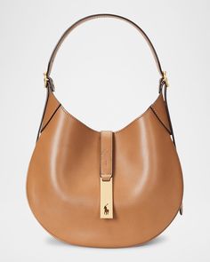 "Find RALPH LAUREN Medium Sport Leather Shoulder Bag on Editorialist. Polo Ralph Lauren shoulder bag in leather Detachable, adjustable shoulder strap Detachable, adjustable crossbody strap Can be worn as a top handle or crossbody bag Open top with magnetic closure Interior, one slip pocket Approx. 10\"H x 10\"W x 1\"D Imported" Ralph Lauren Leather Crossbody Shoulder Bag, Leather Saddle Shoulder Bag With Detachable Handle, Luxury Saddle Shoulder Bag With Adjustable Strap, Ralph Lauren Leather Bags With Adjustable Strap, Luxury Ralph Lauren Office Bag, Ralph Lauren Leather Shoulder Bag, Classic Ralph Lauren Leather Shoulder Bag, Ralph Lauren Leather Shoulder Bag For Everyday Use, Classic Leather Ralph Lauren Shoulder Bag