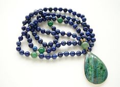 "Lapis Lazuli Necklace Mala Necklace for Women Gift 108 Mala Bead Necklace Blue Beaded Hand Knotted Necklace Yoga Jewelry Gift Long Necklaces - 8mm Natural Blue Lapis Lazuli 108 beads - 12 mm Green Aventurine Guru Bead - 5cm Blue- Green Lapis Lazuli Pendant The length of this necklace is 43 inches plus 2 inches pendant. ♥ ♥ ♥ LAPIS LAZULI ♥ ♥ ♥ is a stone with royal energy, in that it helps you uncover and access your inner noble and Divine nature. It activates psychic abilities and intuition, c Blue Hand-strung Long Necklace, Blue Long Hand-strung Necklace, Blue Round Beads Crystal Necklace For Meditation, Blue Gemstone Beads For Long Necklace, Blue Necklaces With 8mm Beads For Jewelry Making, Blue Necklaces With 8mm Beads As A Gift, Blue Hand-strung Necklace As A Gift, Blue Necklaces With 8mm Beads For Gift, Blue Hand-strung Necklaces As Gift