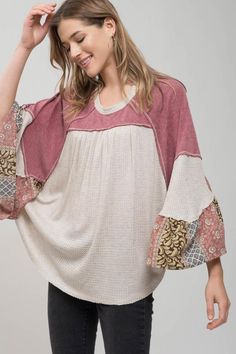 Patchwork Sleeve Blouse This casual blouse features a flowy knit style with a contrasting pattern detail on the sleeves. #bohemianstyle #bohemianfashion #bohoblouse #bohoapparel #hippielifestyle #hippieshirt #patchworkblouse #patchworktop Casual V-neck Blouse With Embroidered Sleeves, Fall Patchwork V-neck Blouse, Fall V-neck Blouse With Embroidered Sleeves, Bohemian V-neck Tops For Layering, Casual V-neck Top With Embroidered Sleeves, Fall V-neck Top With Elastic Sleeves, Trendy Patchwork Tops For Loungewear, Bohemian Textured Knit V-neck Top, Chic Patchwork Tops For Spring