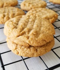 several cookies are cooling on a wire rack