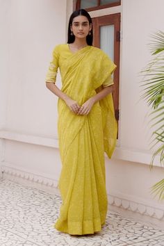 Citrine yellow saree with a scattered discharge print. Paired with a blouse with printed stripes and applique florals. - Aza Fashions Yellow Pre-draped Saree With Chikankari Embroidery For Festivals, Festive Yellow Blouse With Printed Motifs, Yellow Pre-draped Saree With Chikankari Embroidery, Yellow Wedding Saree With Printed Motifs, Yellow Chanderi Saree With Printed Motifs, Festive Yellow Blouse Piece With Printed Motifs, Yellow Saree, Printed Saree, Blouse For Women