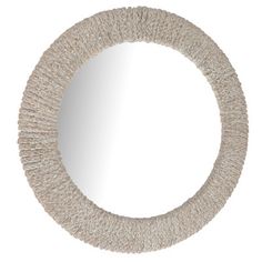 a round mirror with some white yarn on the bottom and one light brown color in the middle