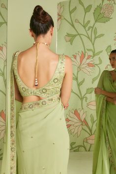 Pistachio green georgette saree with embroidered bead and sequin work. Paired with an embroidered blouse.
Component: 2
Pattern: Embroidered
Type Of Work: Bead work, Cutdana work, Sequins
Neckline: V neck
Sleeve Type: Sleeveless
Fabric: Georgette
Color: Green
Other Details: 
Sheer saree
Occasion: Reception - Aza Fashions Green Embellished Pre-draped Saree For Wedding, Embellished Pista Green Pre-draped Georgette Saree, Fitted Green Pre-draped Saree With Mirror Work, Pista Green Georgette Blouse Piece With Resham Embroidery, Green Pre-draped Saree With Mirror Work For Reception, Green Georgette Blouse With Mirror Work, Pista Green Blouse With Resham Embroidery For Reception, Pista Green Unstitched Blouse In Georgette, Green Pre-draped Saree With Resham Embroidery In Georgette