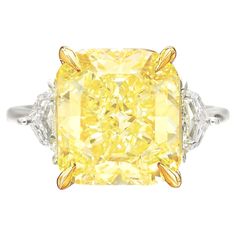 An exquisite 10 carat fancy yellow diamond ring set in platinum and 18 carats yellow gold the ring has been handmade in Italy with two side tapered baguettes also 100% eye clean and full of brilliance! Fancy Yellow Diamond Ring, Radiant Diamond Rings, Graff Diamonds, Orange Diamond, Yellow Diamond Ring, Radiant Cut Engagement Rings, Yellow Diamond Rings, Simulated Diamond Rings, Yellow Engagement Rings