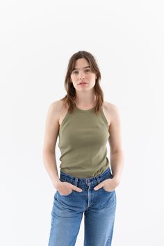 "WW2 Undershirt Tank Top in Olive Green. Low armholes and a flattering neckline. Black faded Letters on back. Material: 100% cotton  |  Made in USA in the 40s. Condition: Good. a few small pin holes - on back..   XSMALL-LONG: Shoulders: 8.5\" | Chest: 14\"  |  Length: 28\" Cassie is 5'8\" and wears a size small top. SHOP http://www.rawsonstudio.etsy.com FOLLOW US + instagram | @_rawson + pinterest | rawson *No Returns. Items are eligible for store credit only. We ask that the buyer ship to provi Fitted Cotton Tank Top With Crew Neck, Fitted Green Everyday Tops, Green Fitted Top For Everyday, Everyday Fitted Green Tops, Fitted Tank Top For Everyday Wear, Fitted Green Cotton Top, Olive Green Tank Top, Undershirt Tank Top, Green Tank Top