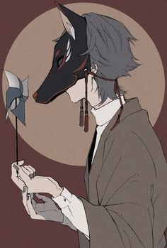 a man in a suit and tie holding a cell phone next to a wolf mask