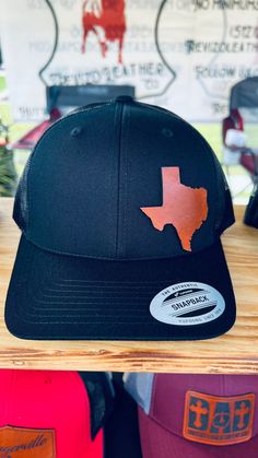 Texas Silhouette Leather Patch Hat, Custom Leather Patch Hats Ready to rock this "Texas Silhouette" leather patch hat!! We bet you are!! :) Get yourself a handmade leather patch hat that will leave a lasting impression!  This is superb gift for Husbands, Dads, Grandads and any Texas Lovers out there. Cleaning: Hats should be gently spot cleaned with damp rag only. HOW TO ORDER: 1. Select Quantity  2. Select Hat Color  Your order is individually handmade by me or my wife Karina. Little helper Isabella (our 1yr  old daughter) will be there to inspect it gets done correctly.  We only use the best, full grain, genuine leather. Each leather patch is laser engraved and then individually hand stained making each patch unique. It is sealed with a leather finish.  Leather Patches are bonded to all Black Leather Hat With Leather Patch, Black Hat With Leather Patch One Size, Black Hat With Leather Patch, One Size Fits Most, Black Hat With Leather Patch, Black Hats With Leather Patch, Black Leather Snapback Hat With Curved Brim, Black Leather Snapback Hat, Black Leather Trucker Hat With Leather Patch, Black Leather Adjustable Snapback Hat