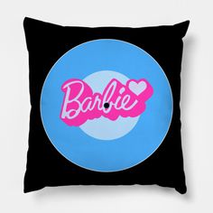 a black and blue pillow with the word barbie in pink on it's center