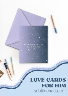 the love cards for him are laid out next to some pencils and an envelope