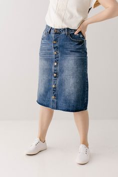 The perfect combination of vintage and feminine - the 'Hilda' denim skirt walked straight out of the 90's into your closet! A distressed denim skirt is one of our favorite staple pieces and the details on this one are exceptional! Quality no stretch denim, a slight A-line style, functioning pockets, brass buttons, and a raw hem. Easily transitional; you can wear it with sandals and your favorite tee for the summer or pair it with a sweater and boots for the fall! Exclusively designed by us for y Dark Wash Mid-rise Denim Skirt, Denim Skirt With Button Closure For Fall, Fall Denim Skirt With Button Closure, Dark Wash High Rise Relaxed Fit Skirt, Mid-rise Washed Denim Skirt, Denim Skirt With Button Closure In Dark Wash, Mid-rise Medium Wash Denim Skirt, High Waist Medium Wash Relaxed Denim Skirt, High Waist Relaxed Fit Medium Wash Denim Skirt