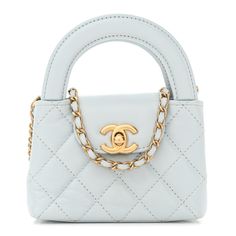 This is an authentic CHANEL Shiny Aged Calfskin Quilted Mini Nano Kelly Shopper in Light Blue. This mini bag is a twist on an archival Chanel bag, featuring a long crossbody chain strap. This dual top handle bag is quilted in shiny aged calfskin leather in blue, accented by aged gold hardware, including a Chanel CC turn-lock at the flap. This opens to a compact leather interior. Blue Chanel Bag, Archival Chanel, Chanel Kids, Chanel Mini Bag, 90s Chanel, Chanel Flap Bag, Chanel Mini, Handle Bag, Flap Bag