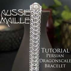 a close up of a vase on a table with the words aussie maille in front of it