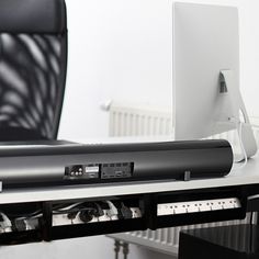 a computer monitor sitting on top of a desk