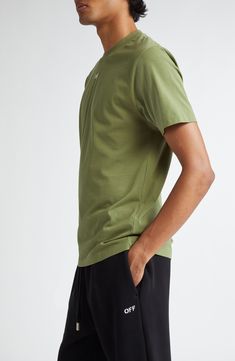 Soft, breathable cotton makes an easy go-to of a T-shirt that's styled in mossy green and embroidered with a tiny logo on the center of the chest. Crewneck Short sleeves 100% cotton Hand wash, dry flat Made in Portugal Designer Clothing Black Owned/Founded Green Cotton Crew Neck T-shirt, Olive Relaxed Fit Short Sleeve Top, Olive Short Sleeve Top With Relaxed Fit, Olive Cotton Crew Neck Tops, Green Sporty T-shirt For Everyday Wear, Green Classic Relaxed Fit T-shirt, Classic Green Relaxed Fit T-shirt, Green Sporty T-shirt With Relaxed Fit, Olive Relaxed Fit Cotton Top