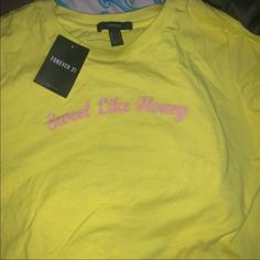 A Bright Yellow T-Shirt With Pink Writing. Never Worn. Brand New With Tag. Cute Yellow Tops With Text Print, Cute Yellow Text Print Top, Yellow Graphic Tee Shirt With Text Print, Yellow Graphic Tee With Text Print, Forever 21 Yellow Cotton Top, Trendy Yellow Forever 21 Tops, Trendy Yellow Top With Text Print, Trendy Forever 21 Cotton Shirt, Forever 21 Yellow Casual Top