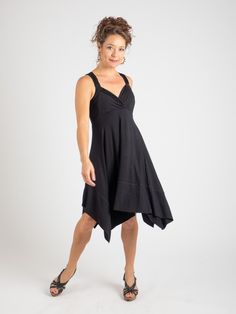 This bias cut dress is made from stretchy rayon jersey is generously sized throughout the waist, hips and chest. [#details] Size Suggestions S: 2-6 M: 6-8 L: 10-12 [/details] [#fabric] Rayon Lycra: 90% Rayon (Viscose) / 10% Spandex (Lycra) [/fabric] Black Stretch Asymmetrical Dress For Spring, Versatile Fitted Summer Dresses, Stretch Dresses With Asymmetrical Hem For Summer, Summer Stretch Dress With Asymmetrical Hem, Versatile Fitted Dress For Spring, Black Elastane Midi Dress For Summer, Casual Elastane Maxi Dress For Summer, Summer Dresses With Flowy, Flattering Silhouette, Stretch Maxi Dress With Flattering Silhouette For Summer